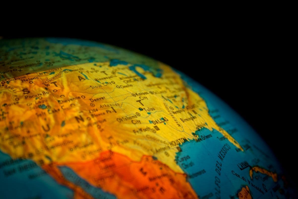 A globe atop an atlas